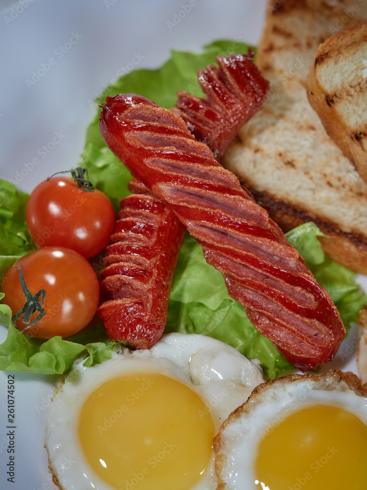Fried eggs with sausage. Fried eggs with sausage.
