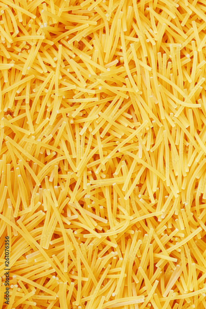 Background texture and pattern of boiled egg noodles or spaghetti pasta in full-frame format. View from above. Close-up Background texture and pattern of boiled egg noodles or spaghetti pasta in full-frame format. View from above. Close-up