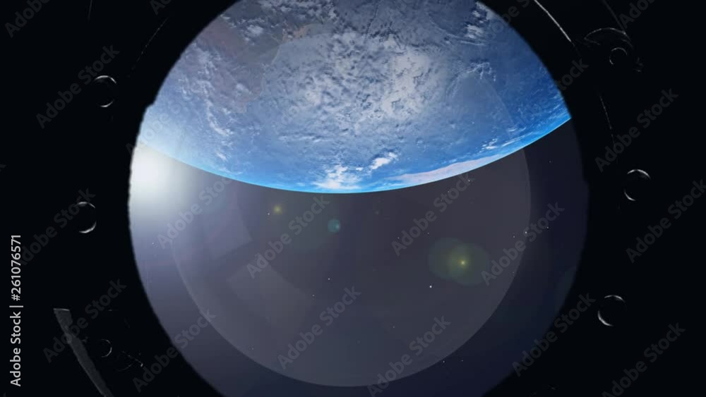 View of the Earth through the porthole of spaceship. International space station View of the Earth through the porthole of spaceship. International space station