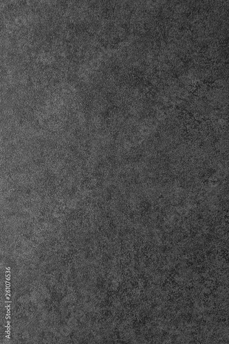 Gradiental vertical dark gray background. Black flooring tile. Texture of gray granite.