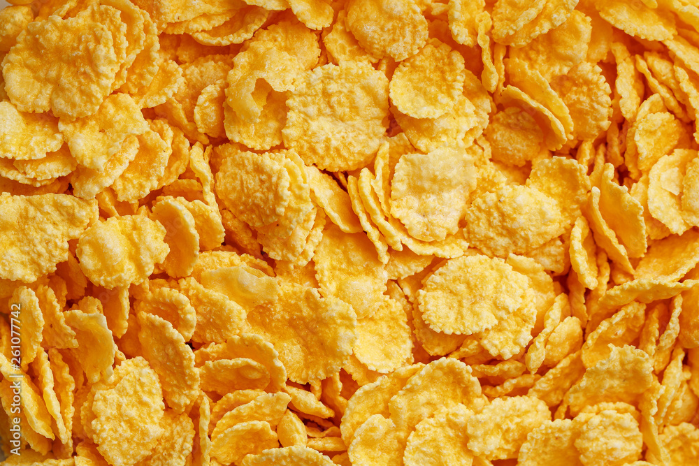Golden cornflakes background and texture. View from above. cornflakes healthy breakfast. Close-up. macro Golden cornflakes background and texture. View from above. cornflakes healthy breakfast. Close-up. macro