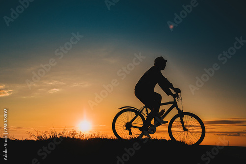 Wallpaper Mural Silhouette of a male mountainbiker at sunset in the mountains Torontodigital.ca
