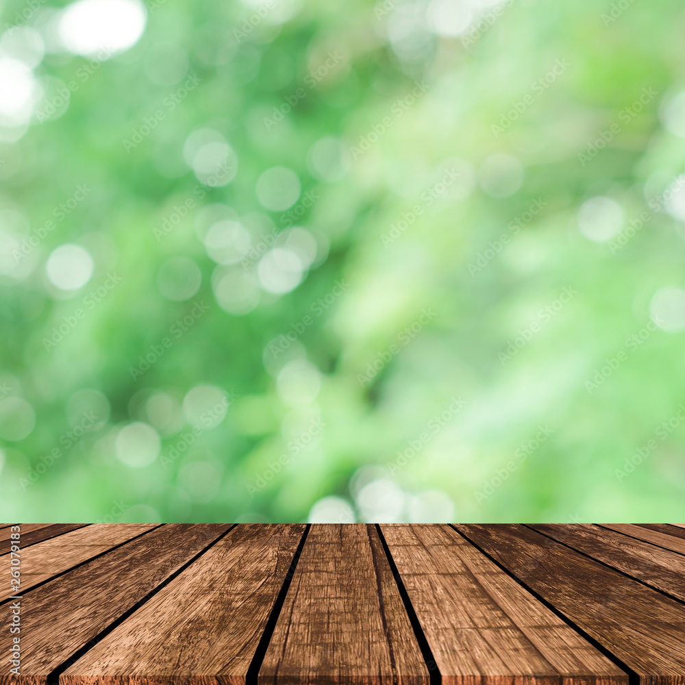 abstract blurred green nature with plank table for show,promote, ads product on image concept