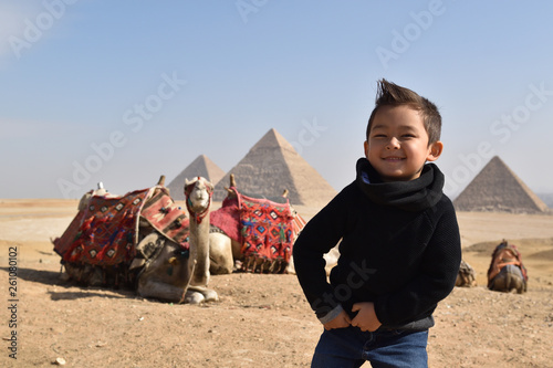 Kid smiling Egypt pyramid traveling with kids