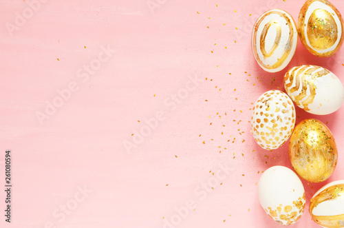 Top view of easter eggs colored with golden paint in differen patterns. Copy space. - Image