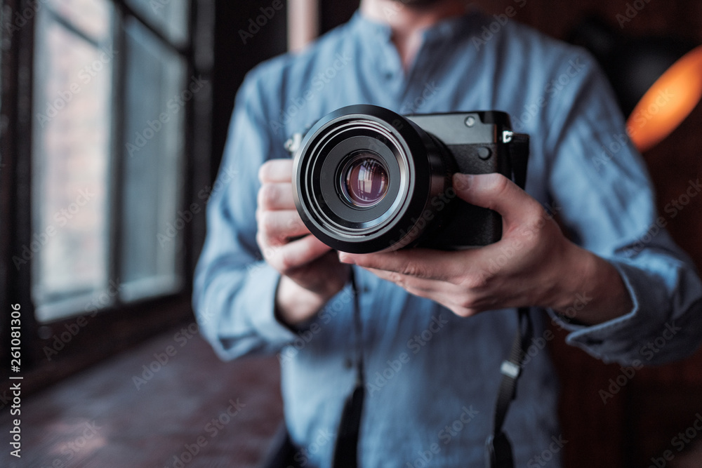 Camera in hand. Close-up of hand holding camera Camera in hand. Close-up of hand holding camera