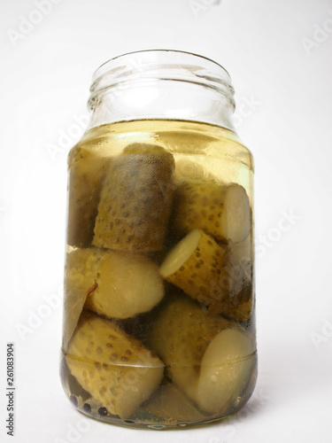 salted homemade rustic cucumbers in a glass jar