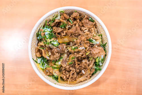 Gyudon or strip beefs with a lots of onion leeks and topped with fresh egg yolk