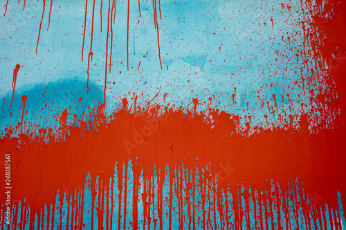 Dripping red paint on warehouse wall