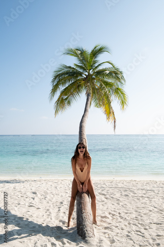 woman sitting on a palm tree