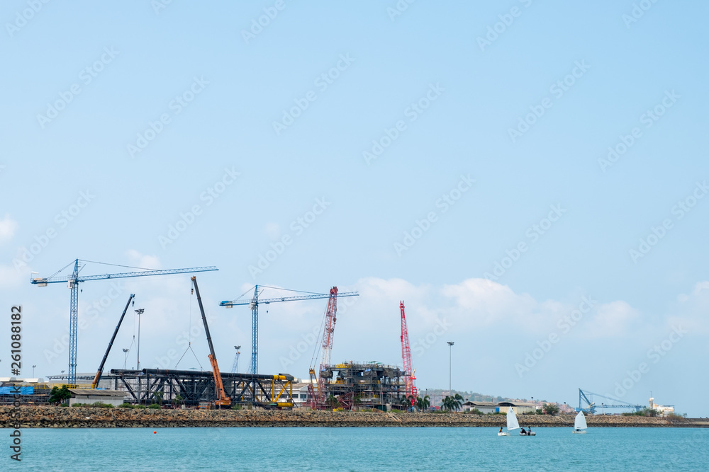 Construction site and blue sea.