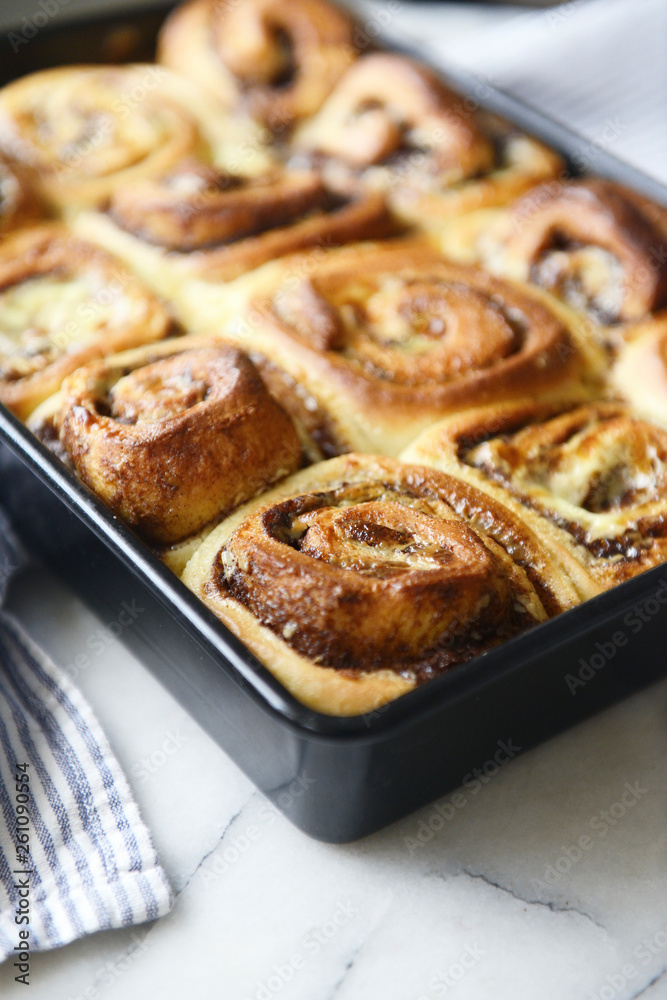 Baking tray full of fresh homemade cinnamon rolls