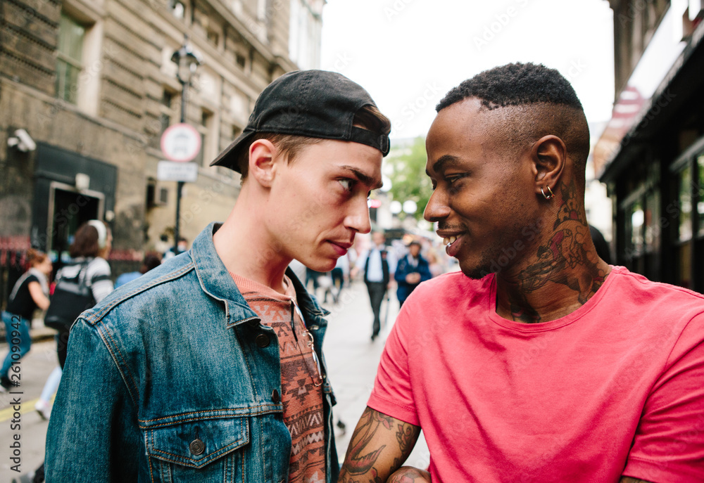 Two young men facing up to each other Two young men facing up to each other