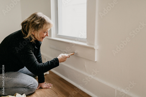 Middle Aged Woman Painting Home photo