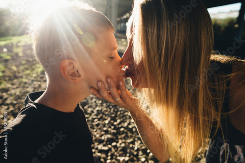 Mother kissing son