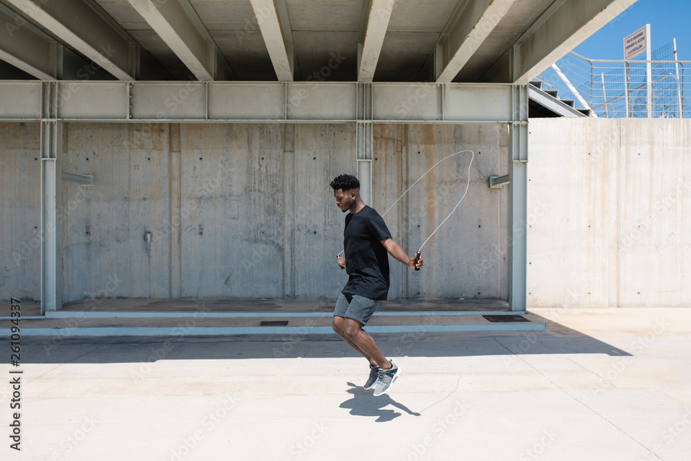 Black man jumping rope outside Black man jumping rope outside