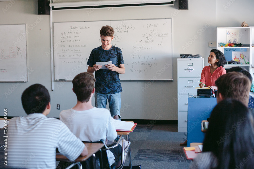 Highschool student giving presentation during class Highschool student giving presentation during class