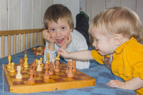 Children play chess. The development of logic, logical thinking. Boys and chess.