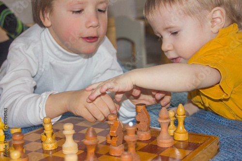 Children play chess. The development of logic, logical thinking. Boys and chess.