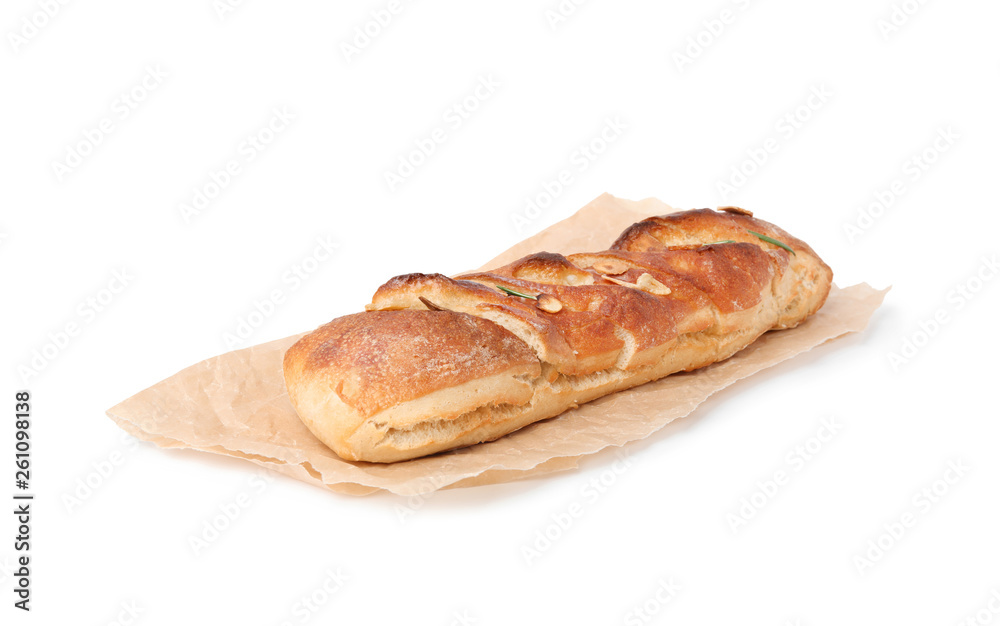 Parchment paper with tasty garlic bread isolated on white Parchment paper with tasty garlic bread isolated on white