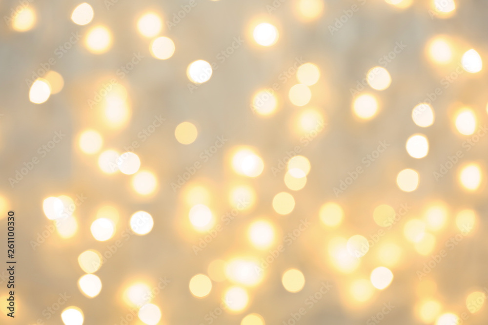 Fototapeta premium Beautiful golden lights as background. Bokeh effect