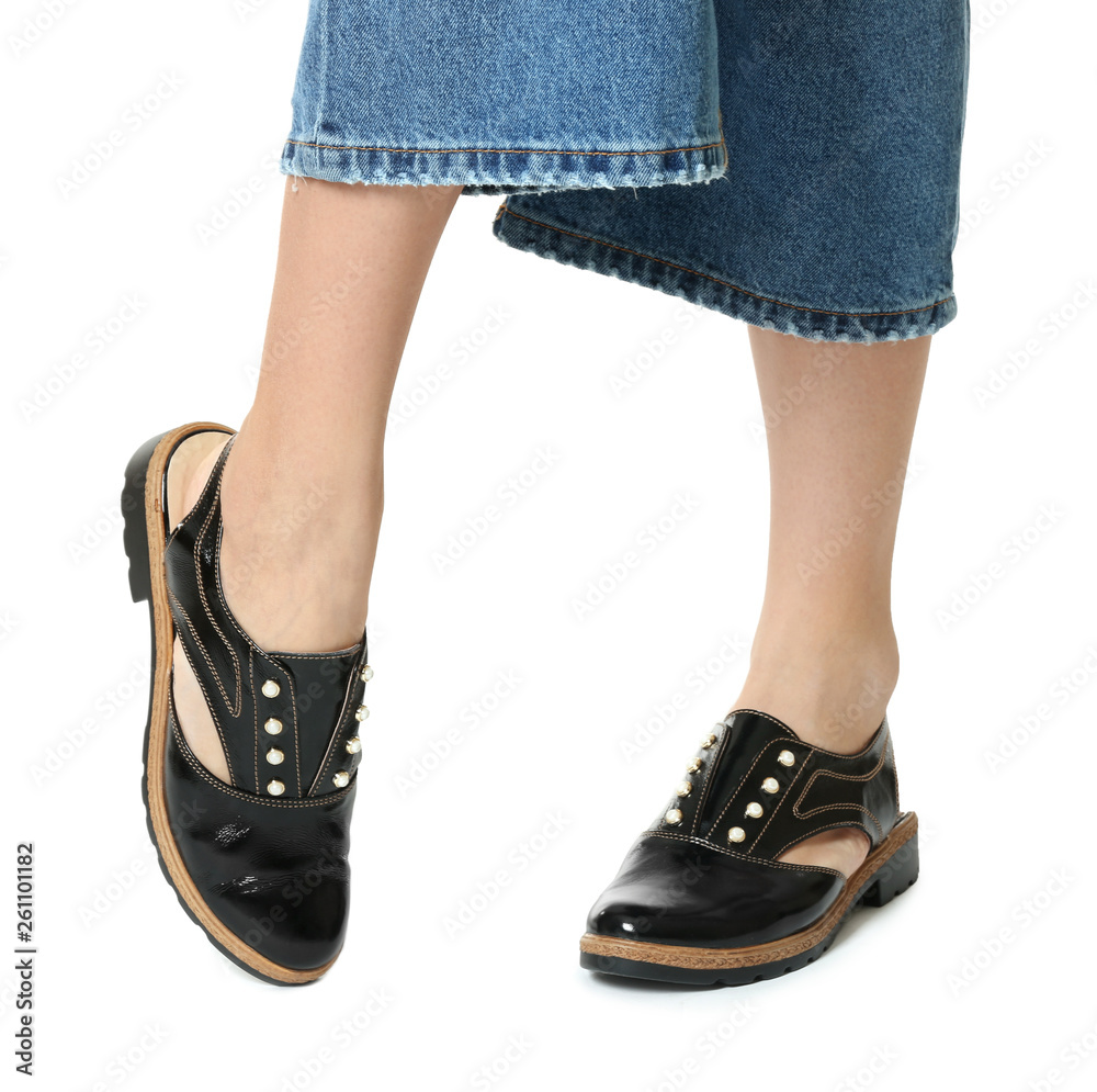 Woman in stylish shoes isolated on white, closeup Woman in stylish shoes isolated on white, closeup