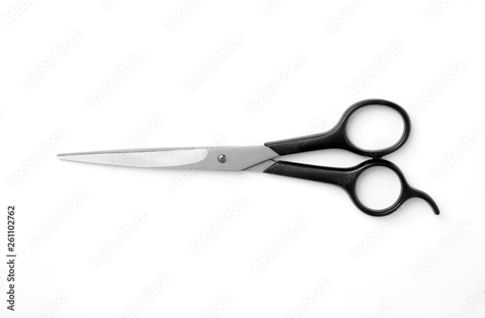 New scissors on white background, top view. Professional hairdresser tool New scissors on white background, top view. Professional hairdresser tool