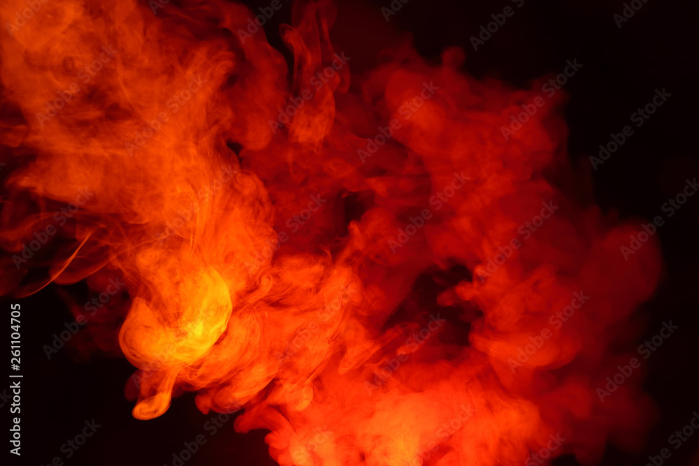 Imitation of bright flashes of orange-red flame. Background of abstract colored smoke.