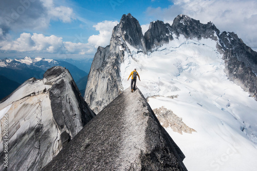Man mountain climbing in Bugaboo Provincial Park, British Columbia, Canada photo
