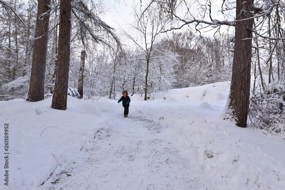 Kid playing in the snow winter time Kid playing in the snow winter time
