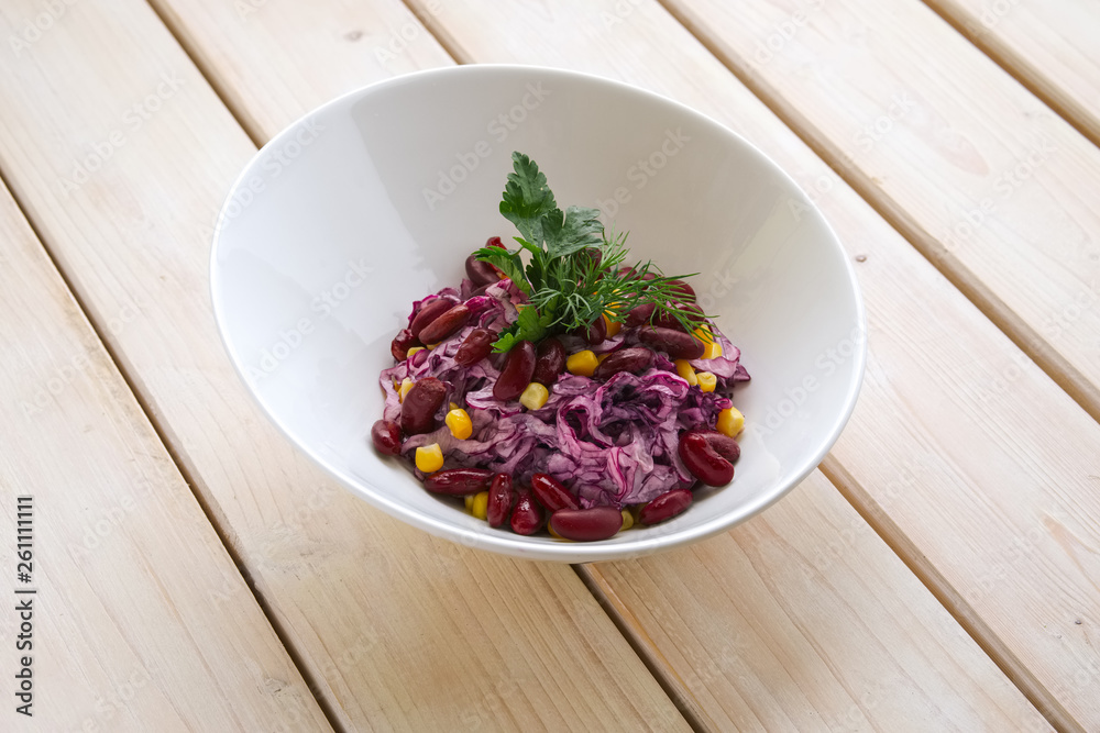 Vegetarian salad with red cabbage, red beans and corn