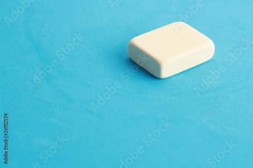 white eraser on color background
