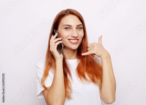 girl talking on a mobile phone over white background
