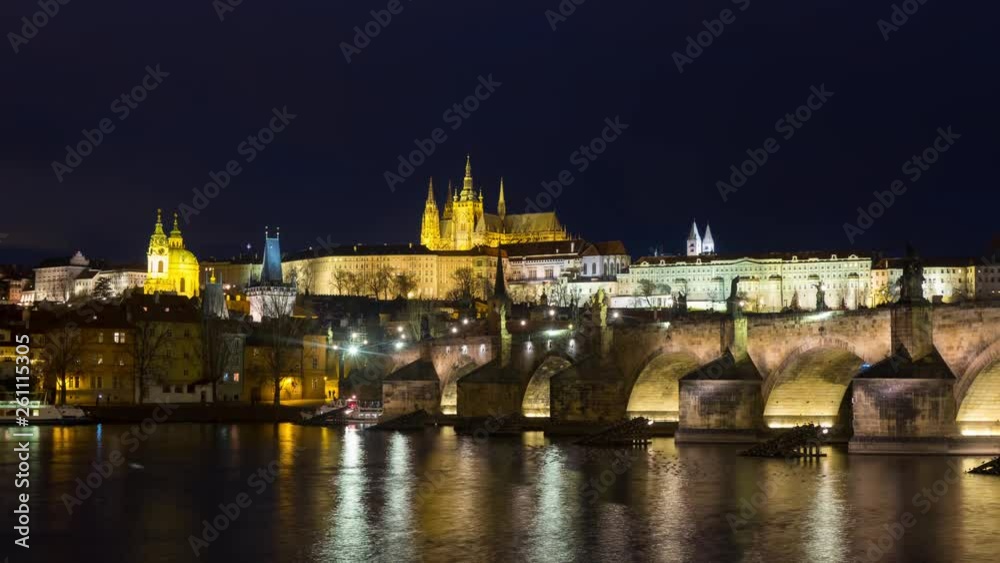 Prague, Czech Republic. Charles Bridge over Vltava river in Prague, Czech Republic. Timelapse during the night with touristic boats and Old Castle. Dark sky time-lapse Prague, Czech Republic. Charles Bridge over Vltava river in Prague, Czech Republic. Timelapse during the night with touristic boats and Old Castle. Dark sky time-lapse