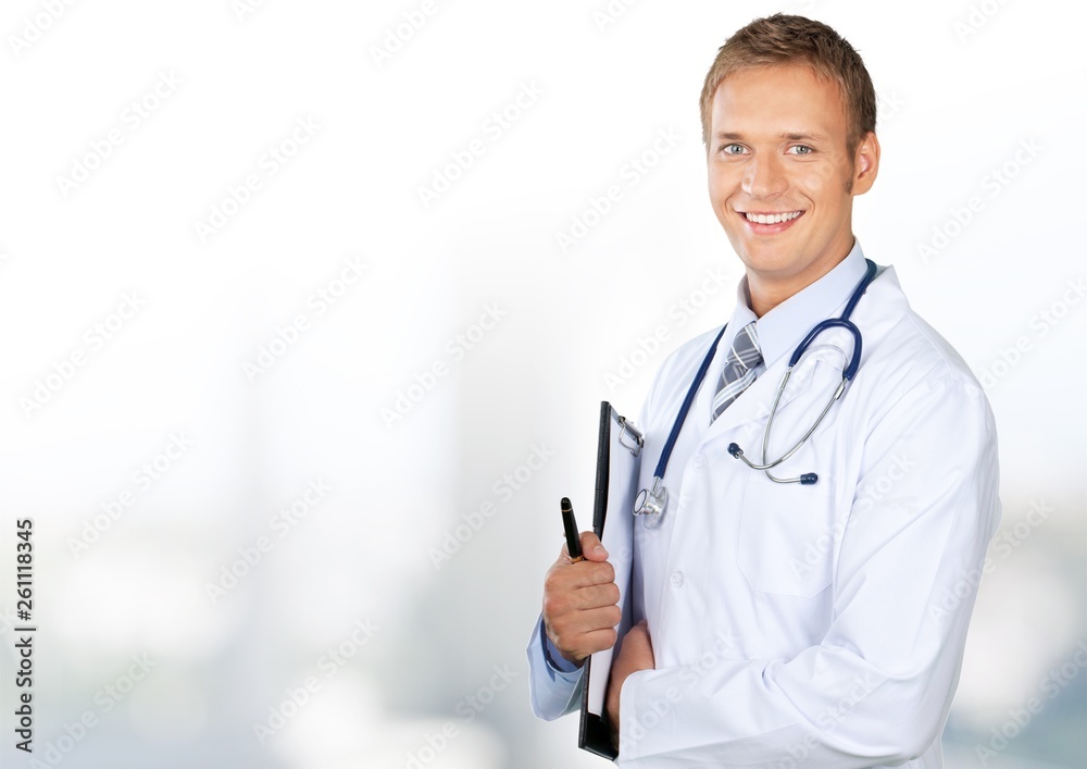 Young doctor portrait at blurred hospital background, bokeh Young doctor portrait at blurred hospital background, bokeh