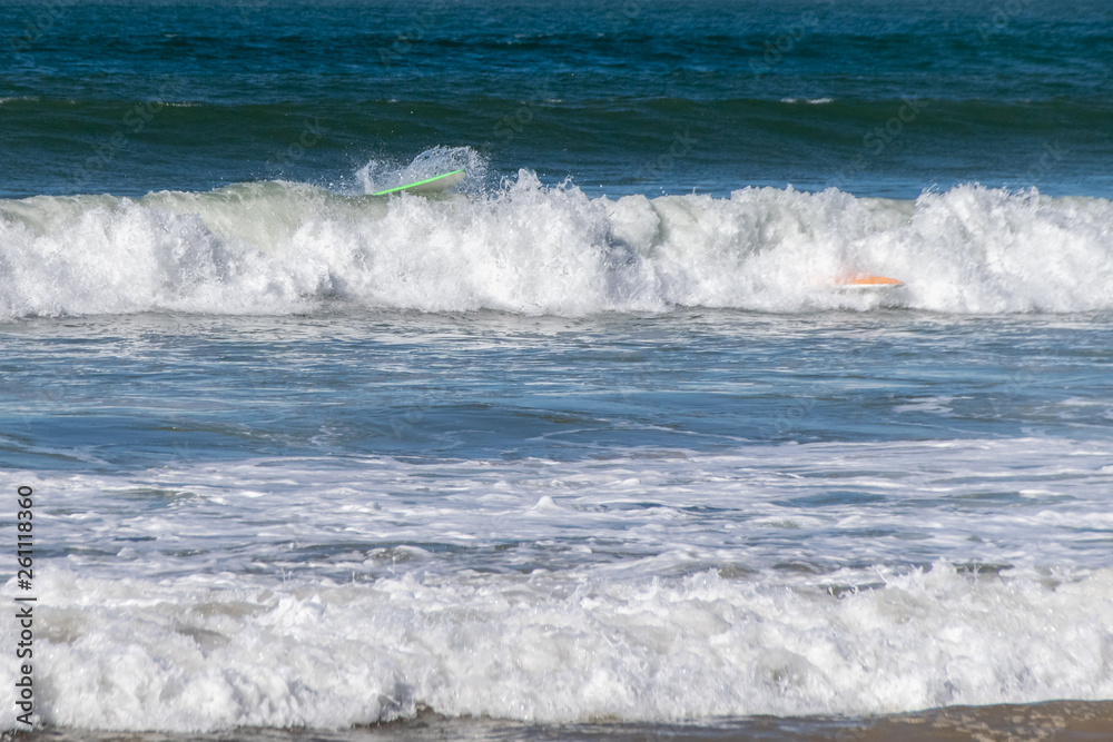 Surfboard wipeout in Atlantic Ocean waves, Morocco