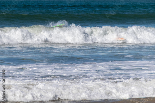 Surfboard wipeout in Atlantic Ocean waves, Morocco
