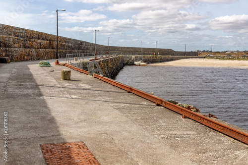 Pier and beach in Galway Bay photo