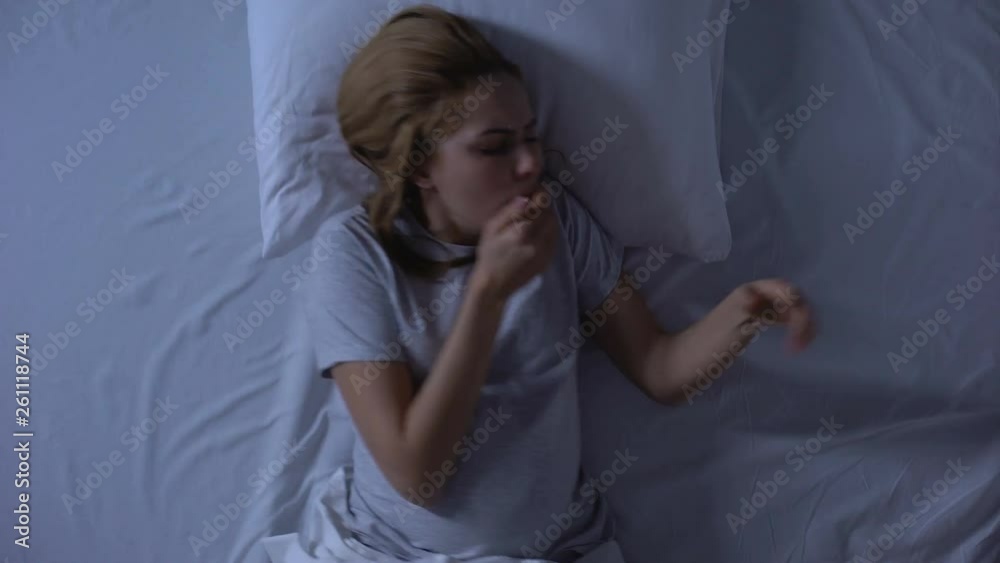Sick pregnant woman suffering from nausea lying bed, toxicosis symptom, health Sick pregnant woman suffering from nausea lying bed, toxicosis symptom, health