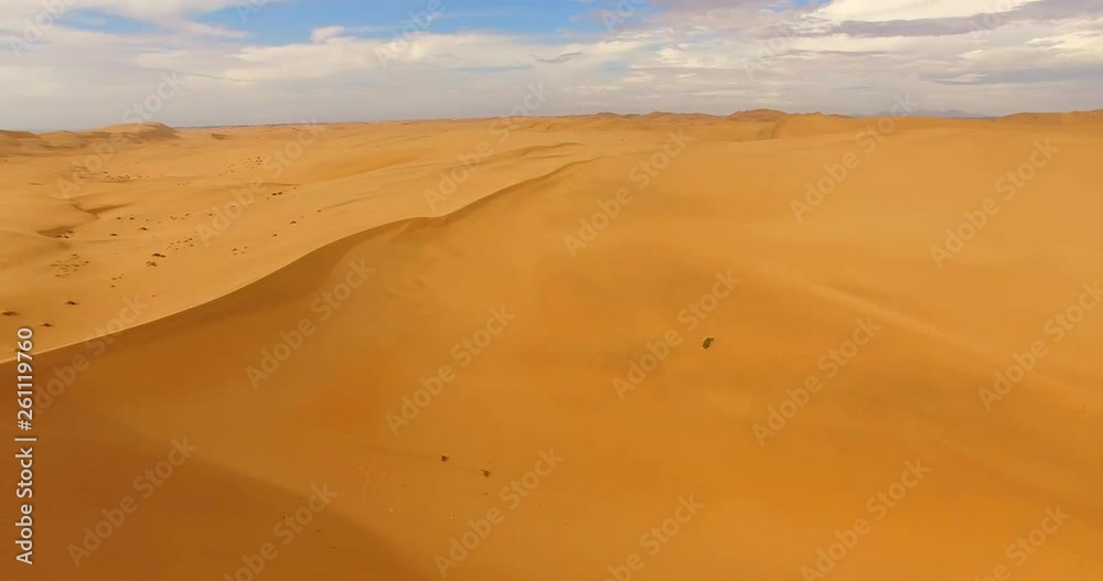 NAMIB-NAUKLUFT NATIONAL PARK, NAMIBIA. Aerial 4K view on the one of the harshest places in the world against the clear blue sky. Spectacular, famous dunes at Sossusvlei area. NAMIB-NAUKLUFT NATIONAL PARK, NAMIBIA. Aerial 4K view on the one of the harshest places in the world against the clear blue sky. Spectacular, famous dunes at Sossusvlei area.