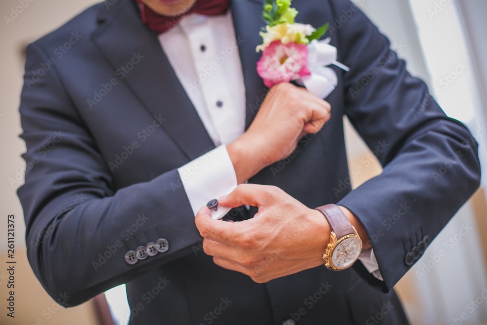 Groom dressing to go to his wedding The groom is preparing for the wedding, going to meet with the bride Groom dressing to go to his wedding The groom is preparing for the wedding, going to meet with the bride