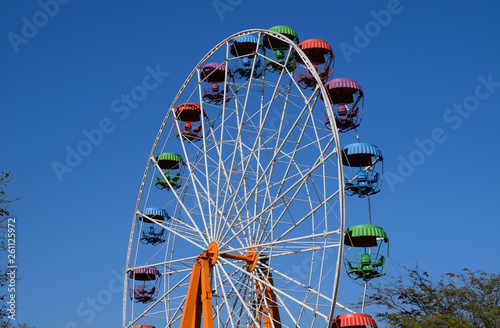 Ferris wheel. Ferris wheel in the city park. Seats for passenger