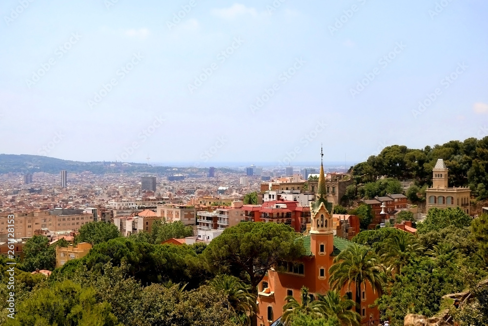 Aerial view of Barcelona from Park Güell with The Gaudi House Museum in the foreground.