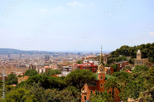 Aerial view of Barcelona from Park Güell with The Gaudi House Museum in the foreground.
