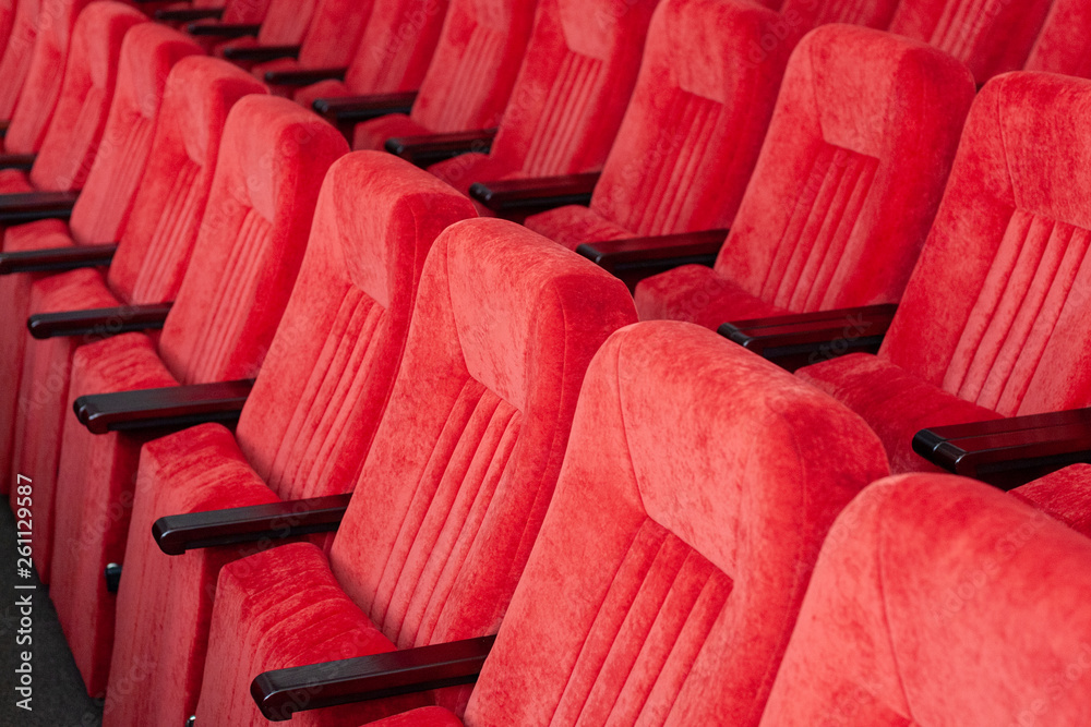 Fototapeta premium red armchairs close up. chairs at conference hall. pattern background.