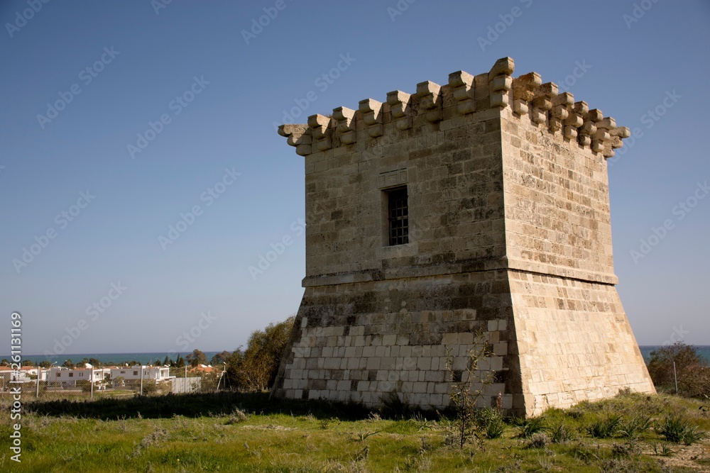 Details of  old historic tower in Cyprus and cloudy sky