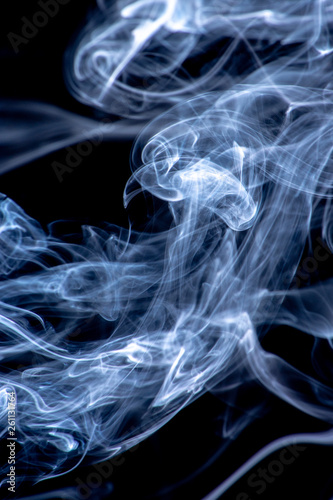 White and blue smoke isolated on a black background