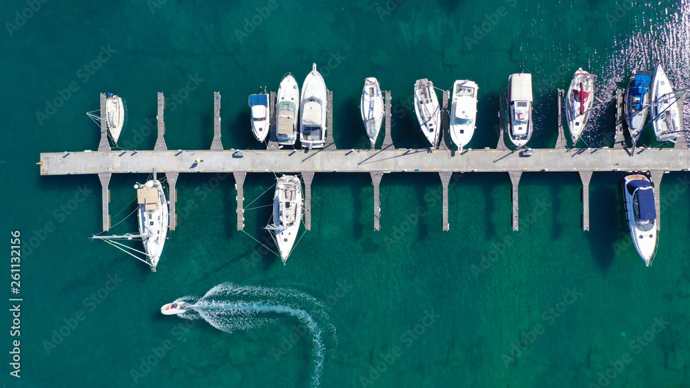 Aerial drone top view photo of mediterranean port with sail boats docked Aerial drone top view photo of mediterranean port with sail boats docked