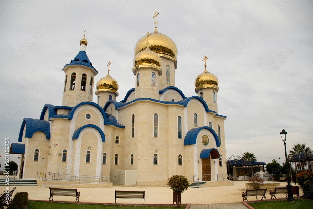Exterior architecture of Russian Orthodox church in Cyprus and cloudy sky 