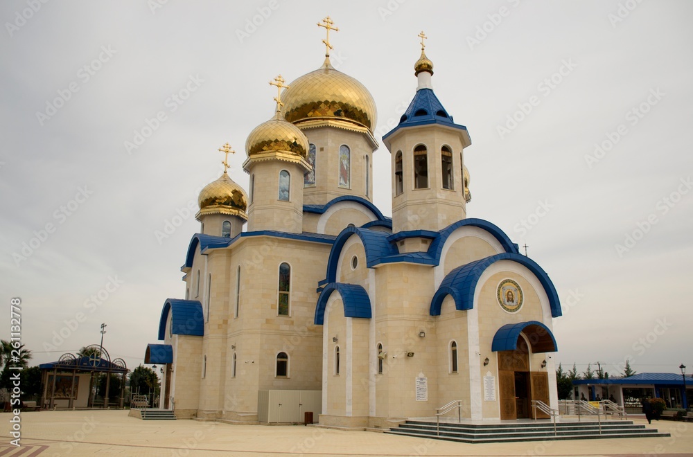 Exterior architecture of Russian Orthodox church in Cyprus and cloudy sky 